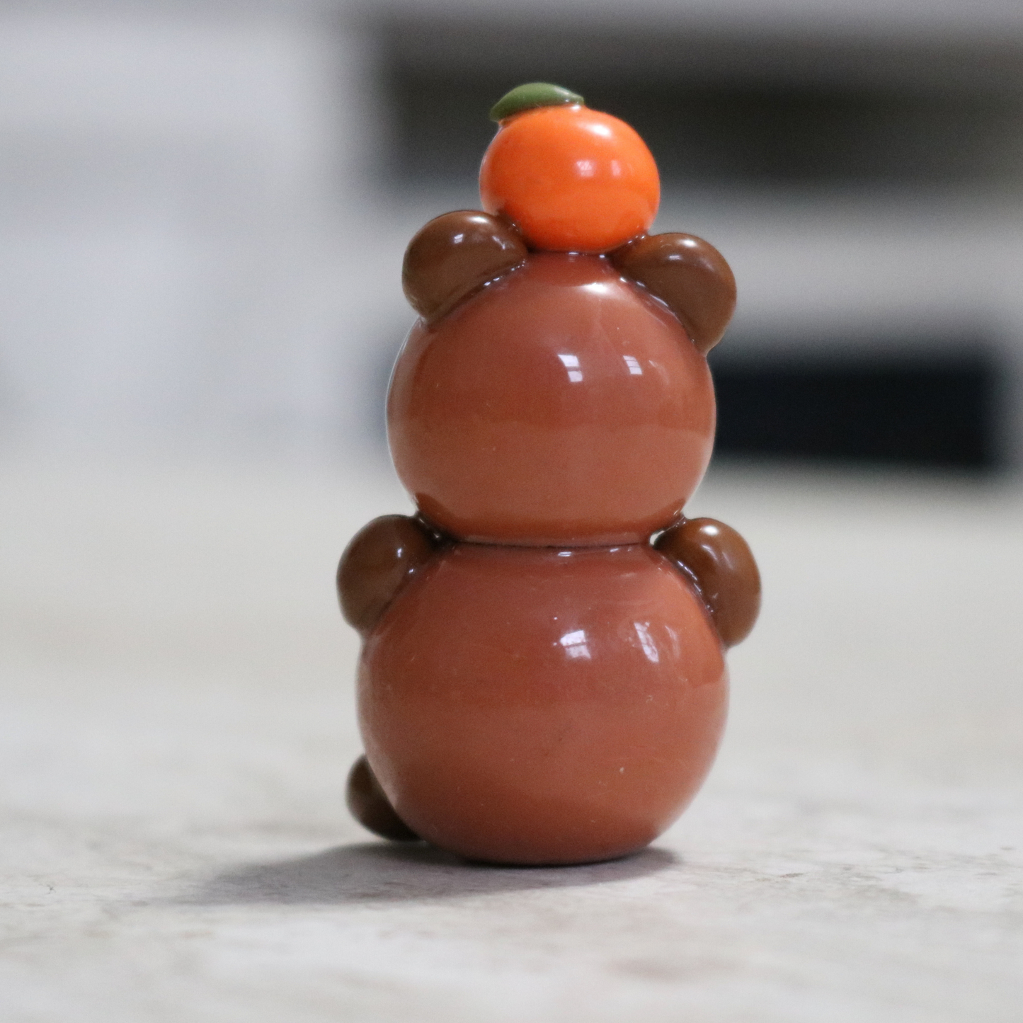Capybara with an Orange Desk Friend